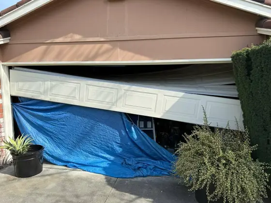 Garage door covered during a repair visit
